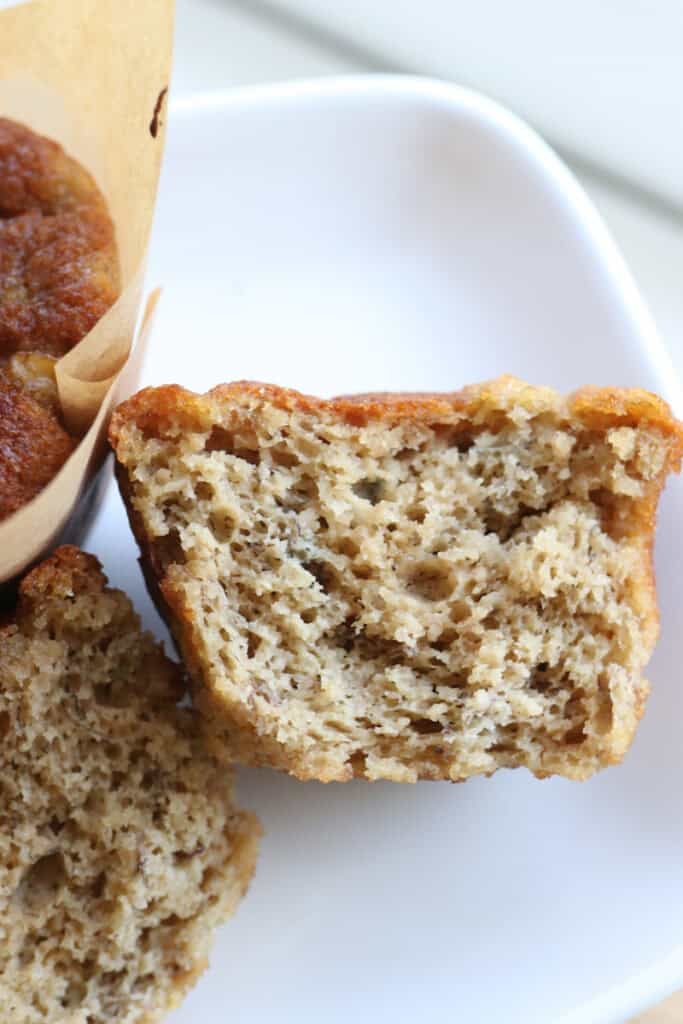 half of a High Protein Easy Banana Muffin on a plate