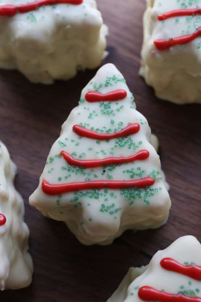 a Fresh Milled Little Debbie Christmas Tree Cakes with red stripes and green sprinkles