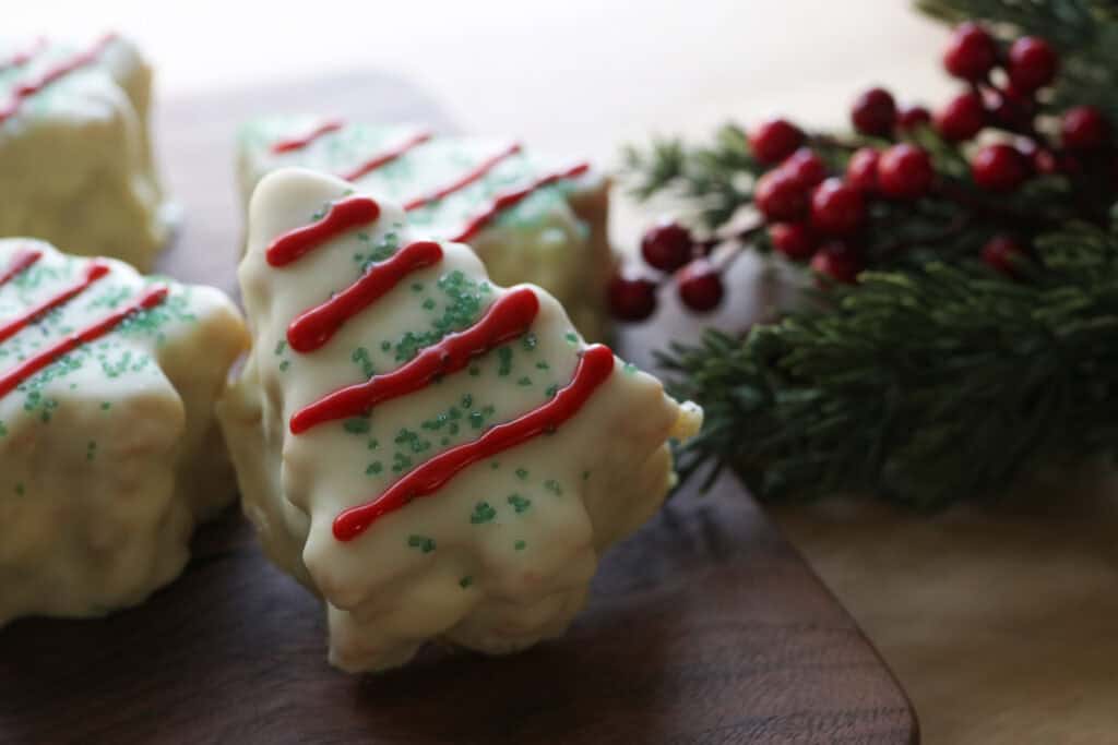 a Fresh Milled Little Debbie Christmas Tree Cake with red stripes on it