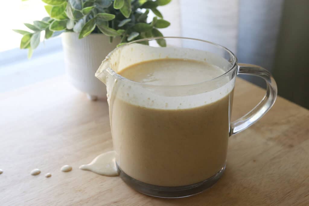 Freshly Milled Healthy High Protein Waffle batter in a measuring cup