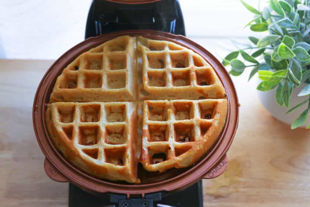 a Freshly Milled Healthy High Protein Waffle in a waffle maker that has been cooked
