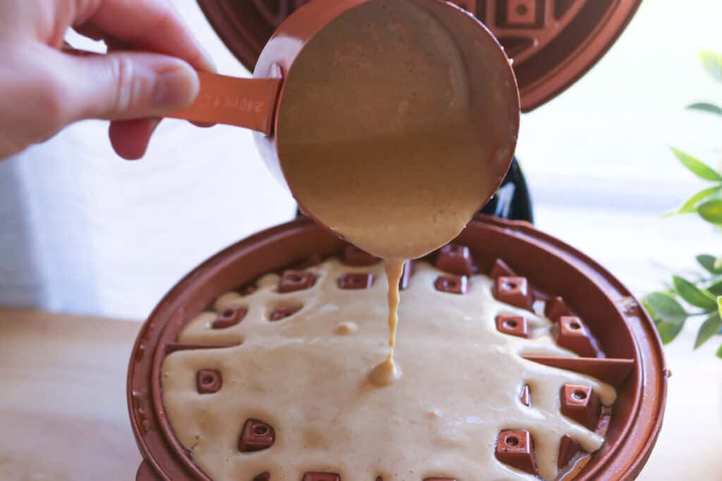Freshly Milled Healthy High Protein Waffle being poured into a waffle maker