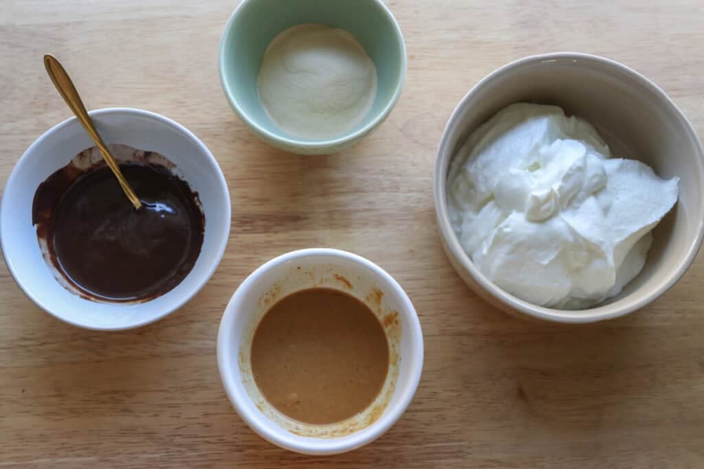 ingredients to make High Protein Chocolate Peanut Butter Yogurt Cups