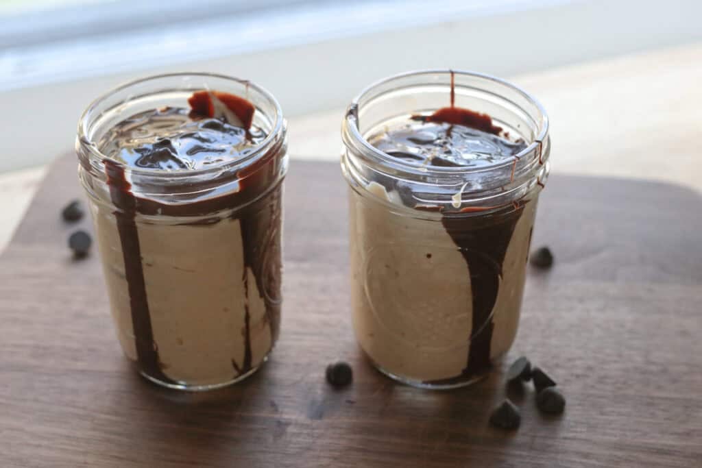 High Protein Chocolate Peanut Butter Yogurt Cups with melted chocolate on top