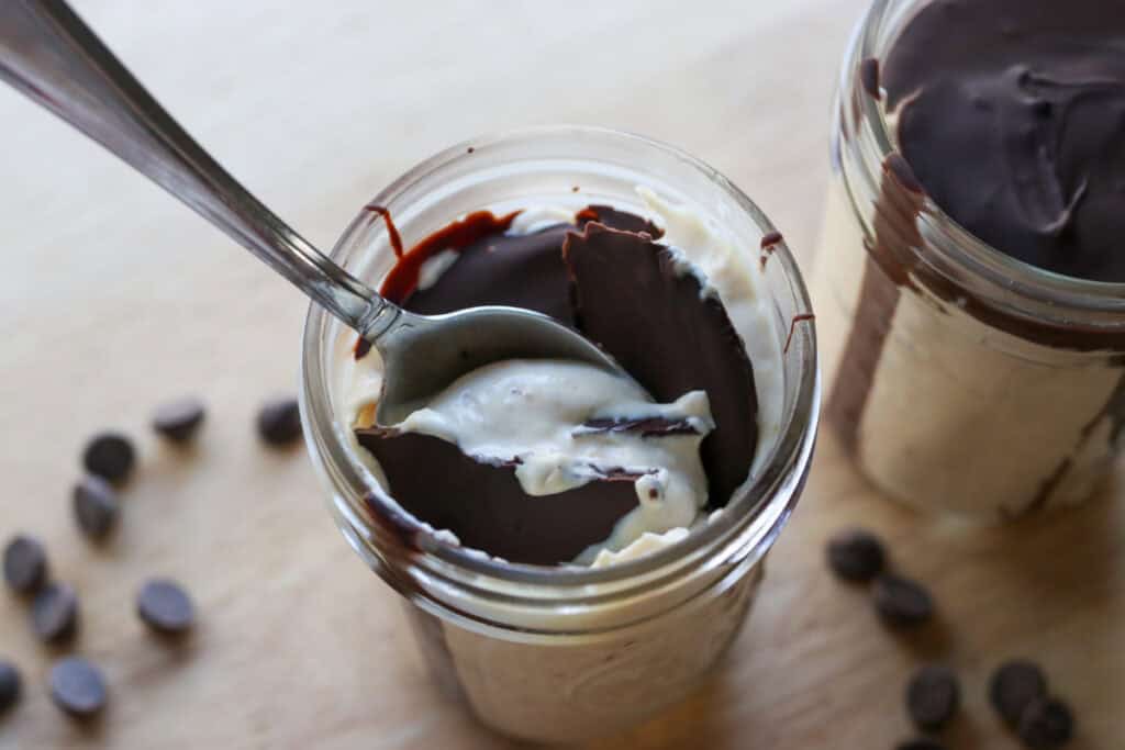 a spoon in a jar of High Protein Chocolate Peanut Butter Yogurt