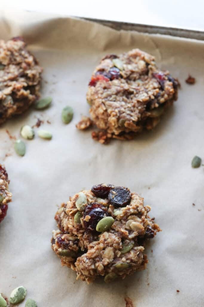 a healthy Breakfast Oatmeal Cookie with dried berries and pumpkin seeds in it