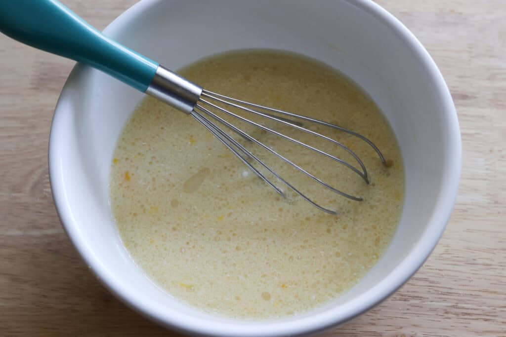 wet ingredients in a bowl to make fresh milled sheet pan protein pancakes