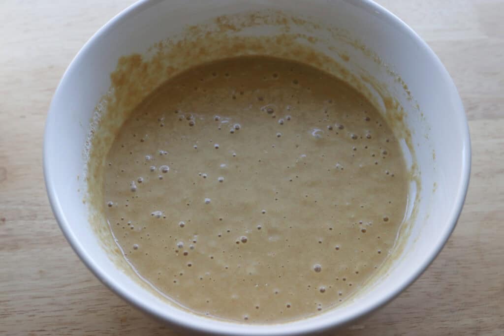 fresh milled sheet pan protein pancake batter in a white bowl