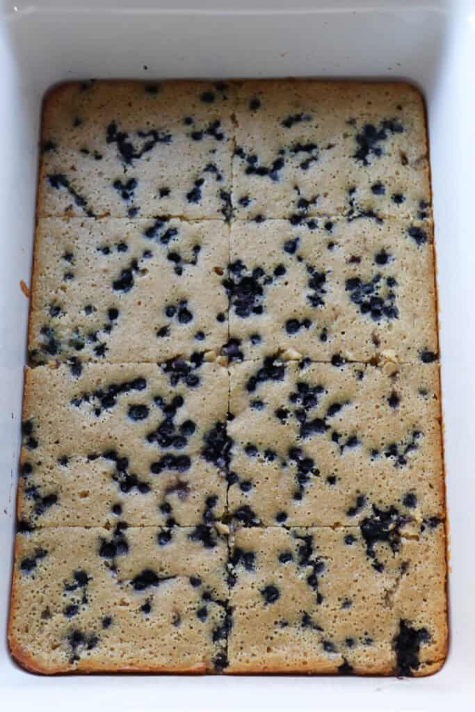 fresh milled sheet pan protein pancakes cut into squares in a white dish