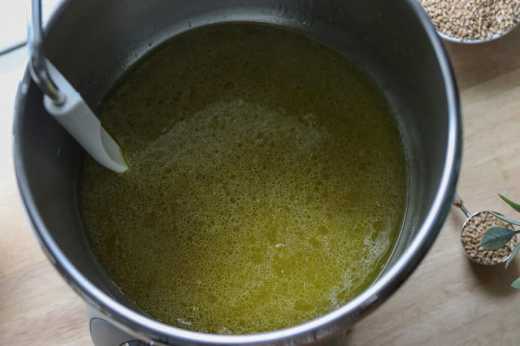 oil, water, and honey in a mixing bowl to make fresh milled tall sandwich loaves using the tangzhong method