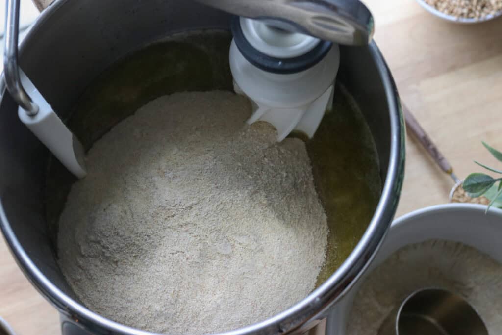 flour added to the mixing bowl to make fresh milled tall sandwich loaves using the tangzhong method