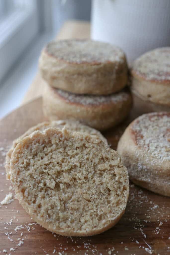 half of a freshly milled english muffin with more stacked behind it