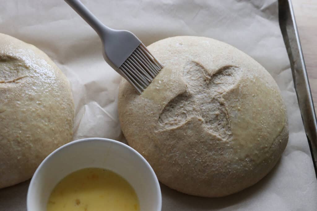 freshly milled soup bread bowls that have been brushed with egg wash