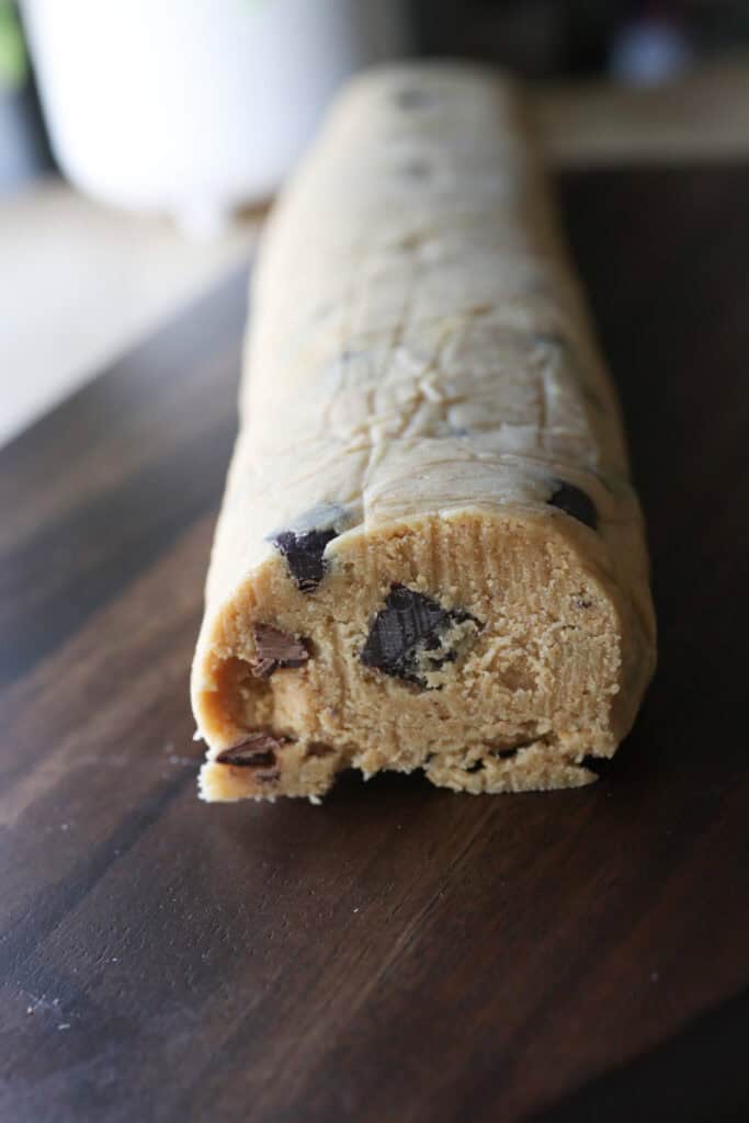 a Freshly Milled Slice and Bake Chocolate Chunk Cookie dough log with chocolate in it