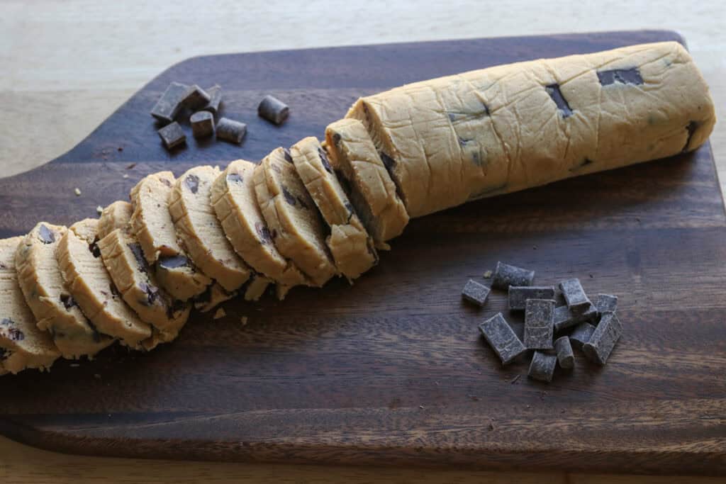 Freshly Milled Slice and Bake Chocolate Chunk Cookie dough log cut into individual cookies