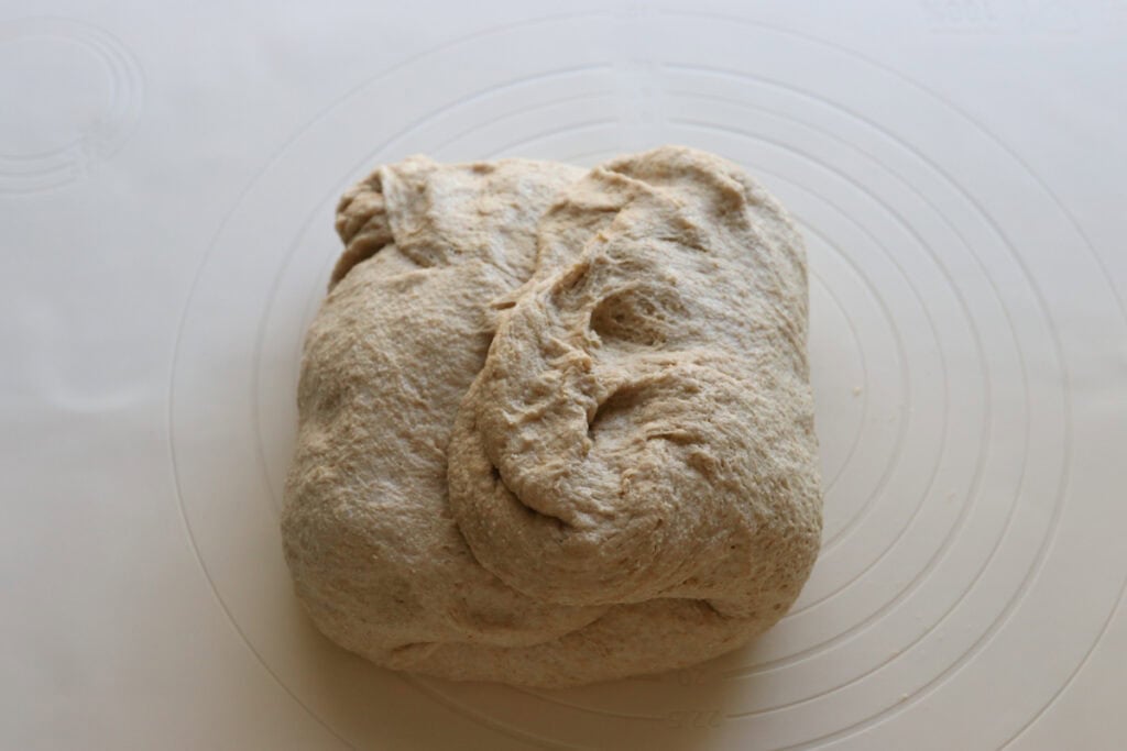 shaping the fresh milled artisan dough into a rectangle