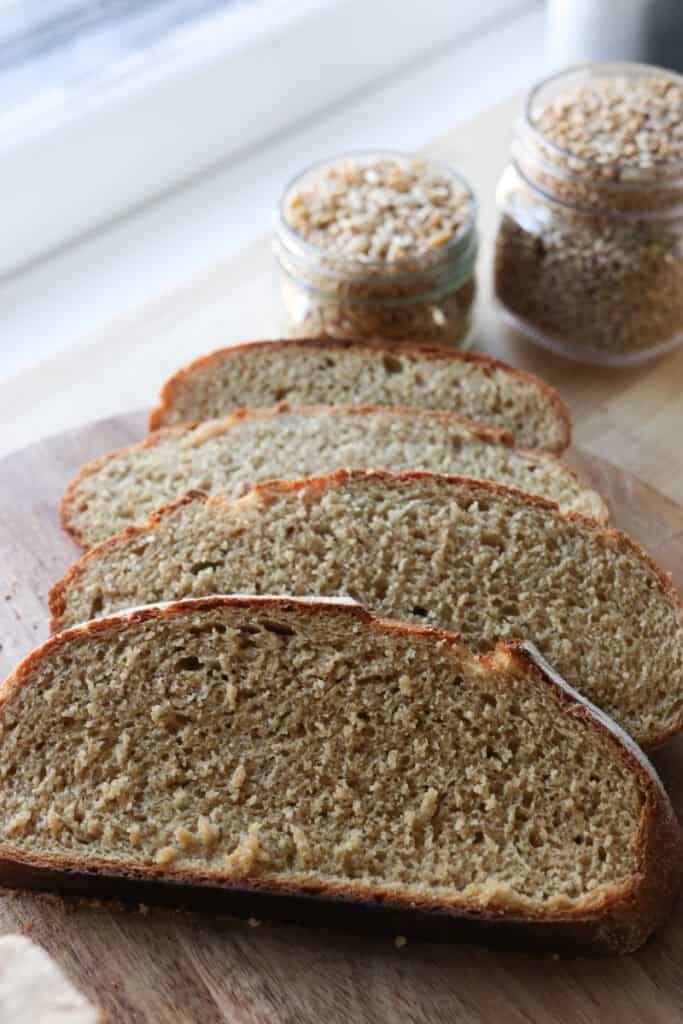 slices of fresh milled artisan bread on a wooden board