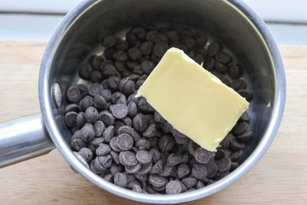 chocolate and butter in a saucepan to make fresh milled buckeye brownie cookies