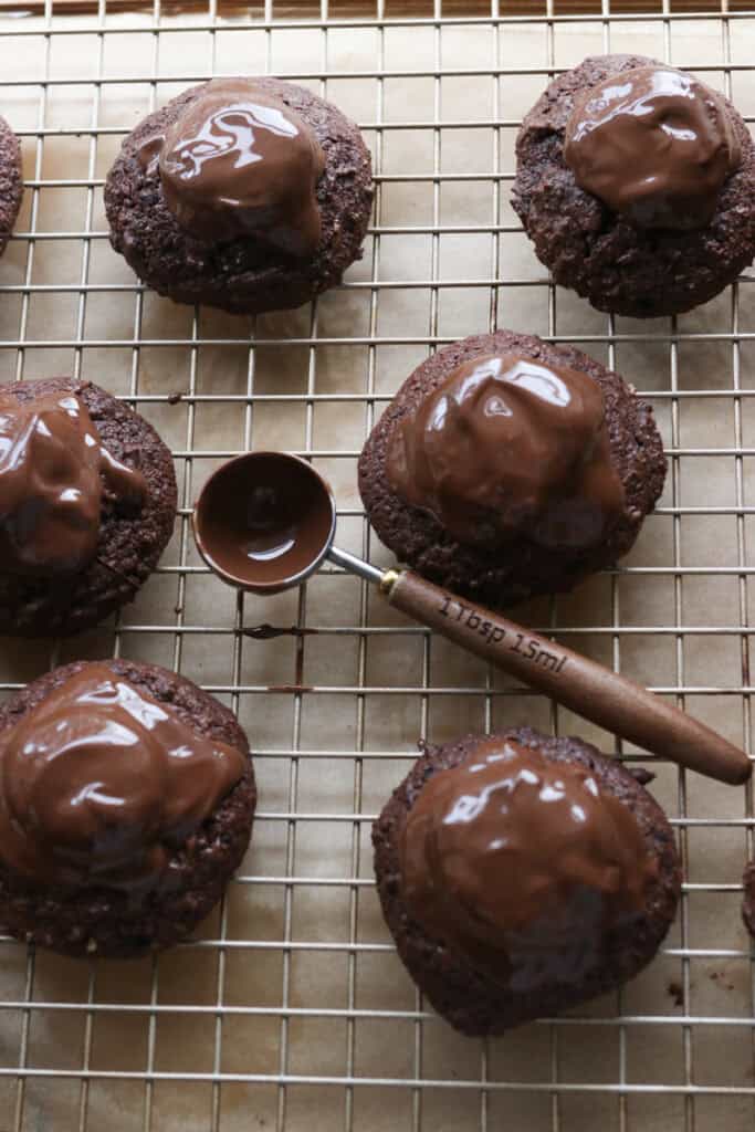 fresh milled buckeye brownie cookies on a wire rack and covered with chocolate