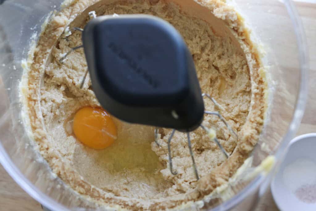 eggs added to the batter for Freshly Milled White Chocolate Macadamia Cookies