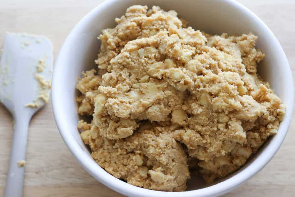 Freshly Milled White Chocolate Macadamia Cookie dough in a white bowl