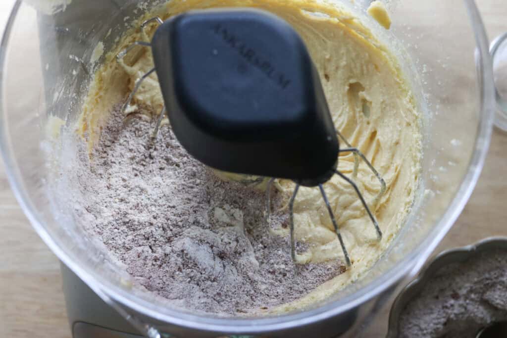 flour and cocoa added to a mixing bowl to make freshly milled red velvet cupcakes