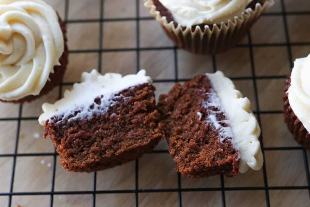 a freshly milled red velvet cupcake that is cut in half