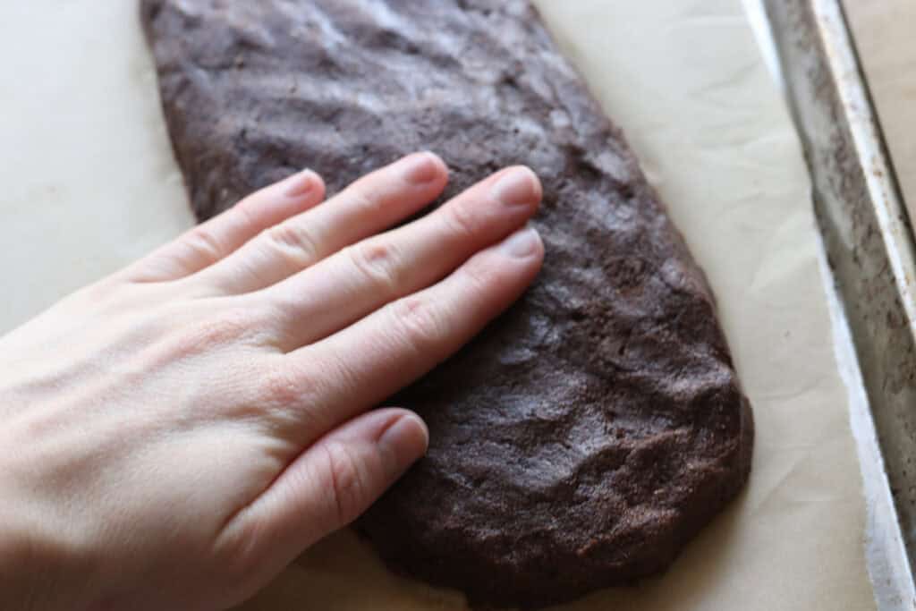 shaping fresh milled double chocolate biscotti into logs
