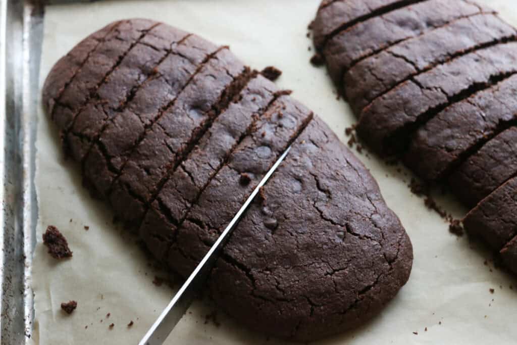 cutting fresh milled double chocolate biscotti into slices