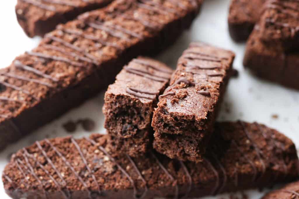 fresh milled double chocolate biscotti with chocolate chips in it on a white platter