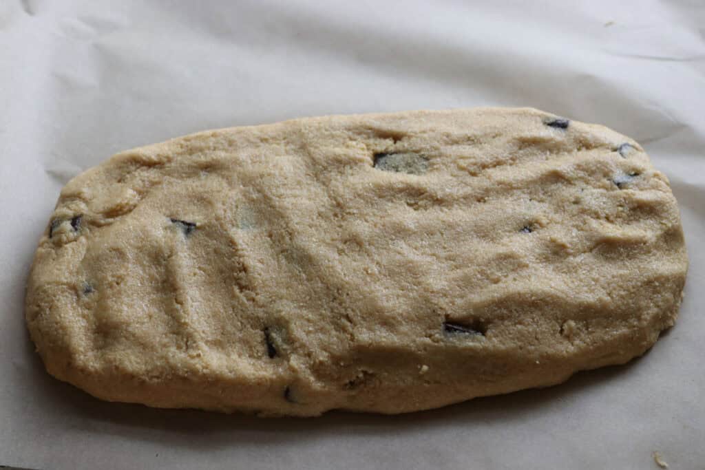 freshly milled chocolate chip biscotti dough that has been shaped into a loaf