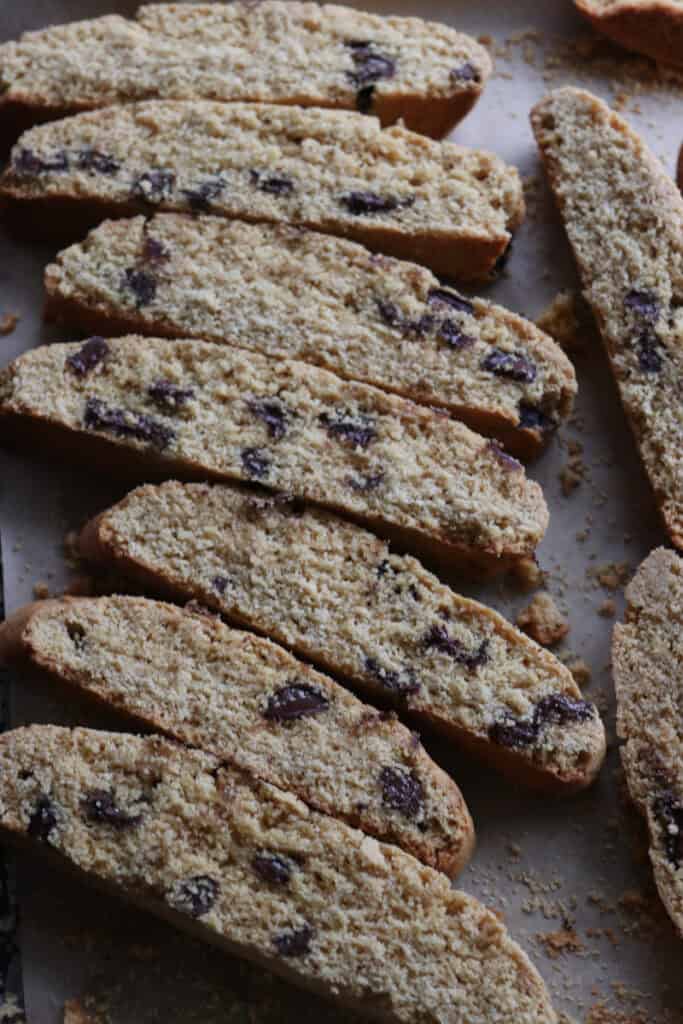 slices of freshly milled chocolate chip biscotti on a baking sheet 