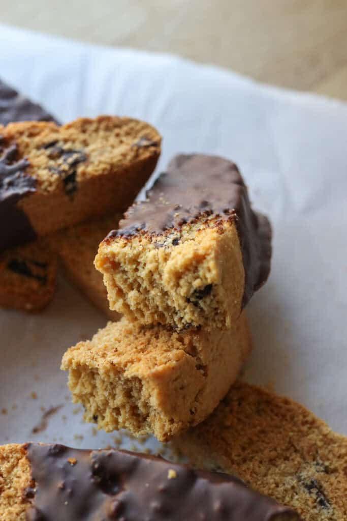 a piece of freshly milled chocolate chip biscotti broken in half