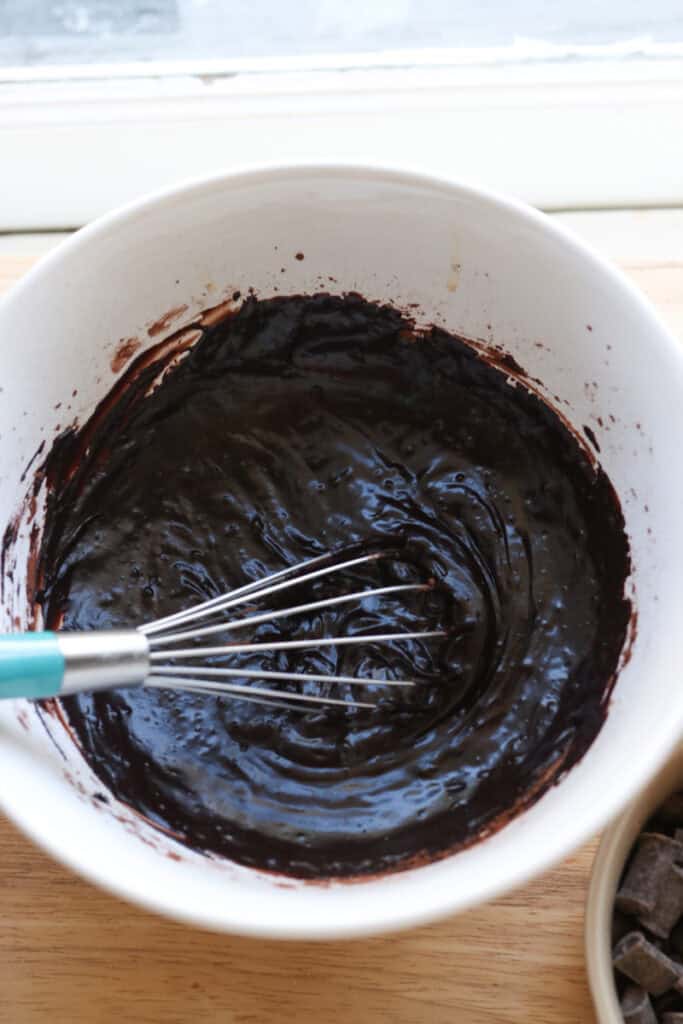 cocoa and butter in a white bowl to make freshly milled fudgy cosmic brownie