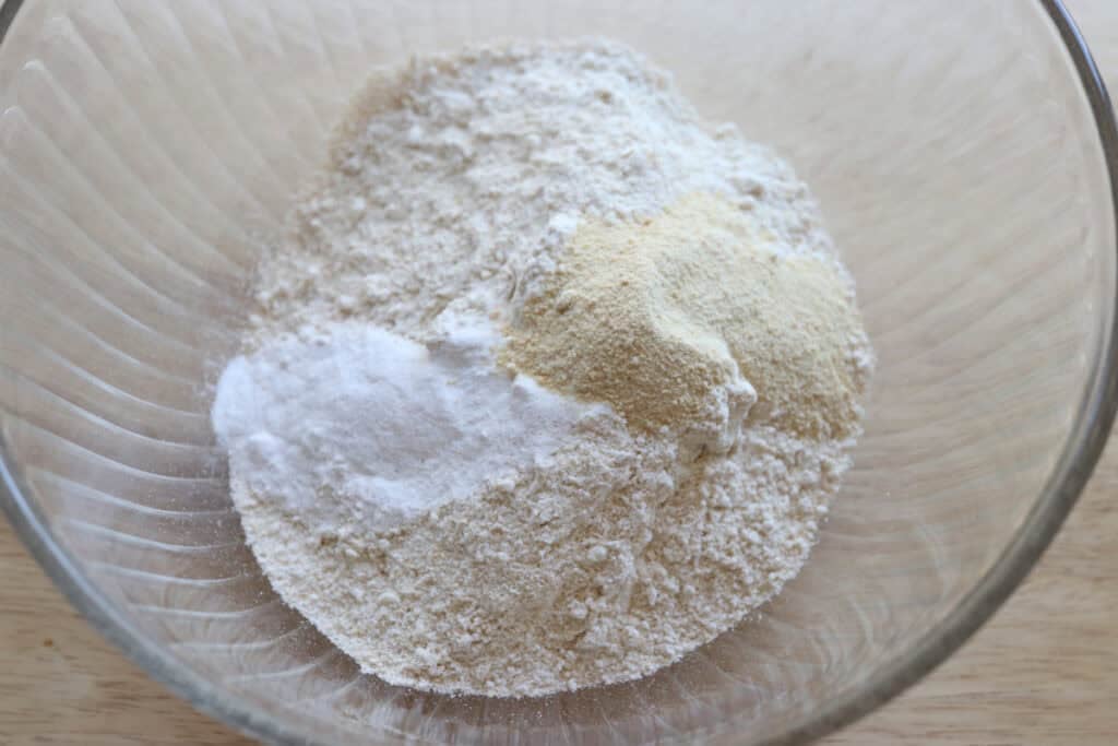 flour and sugar in a bowl to make crisp and flaky fresh milled ritz crackers
