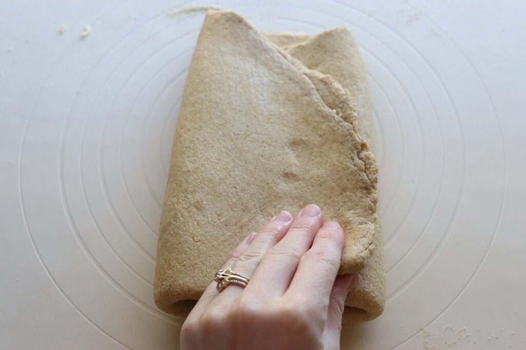 finishing a letter fold for fresh milled flaky buttery croissants