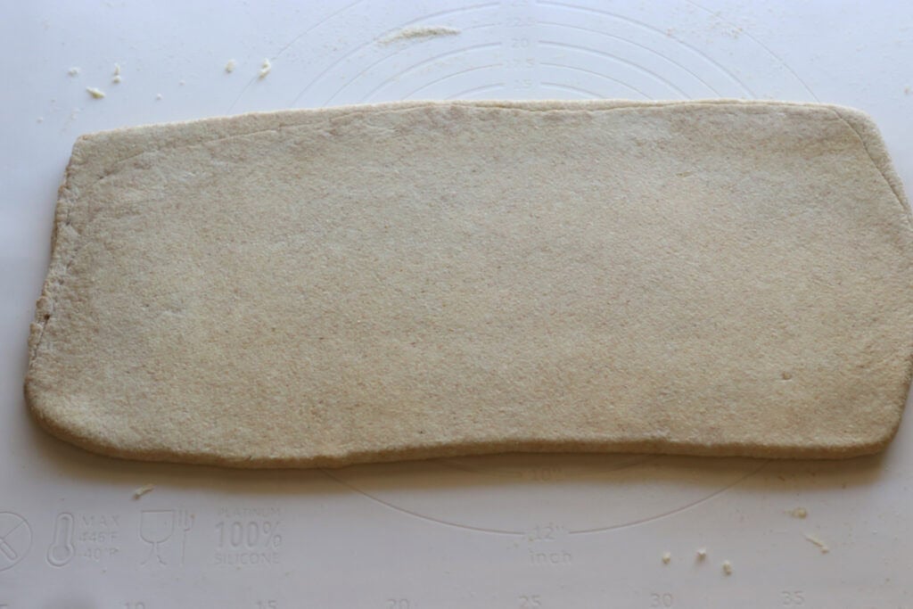 fresh milled flaky buttery croissant dough rolled into a rectangle