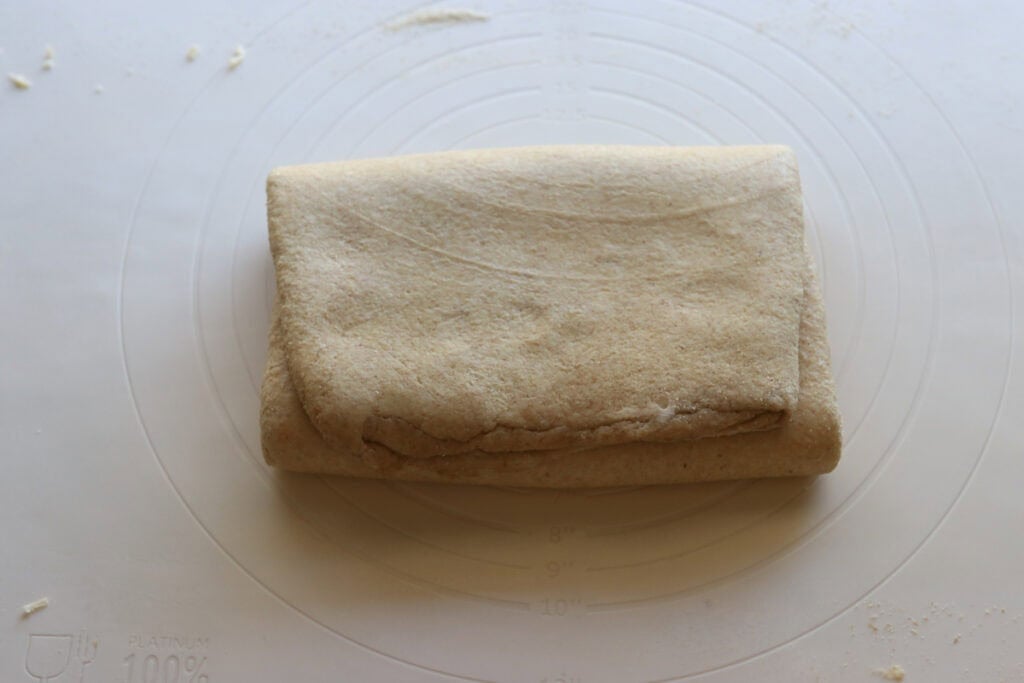 fresh milled flaky buttery croissant dough that has had 4 letter folds