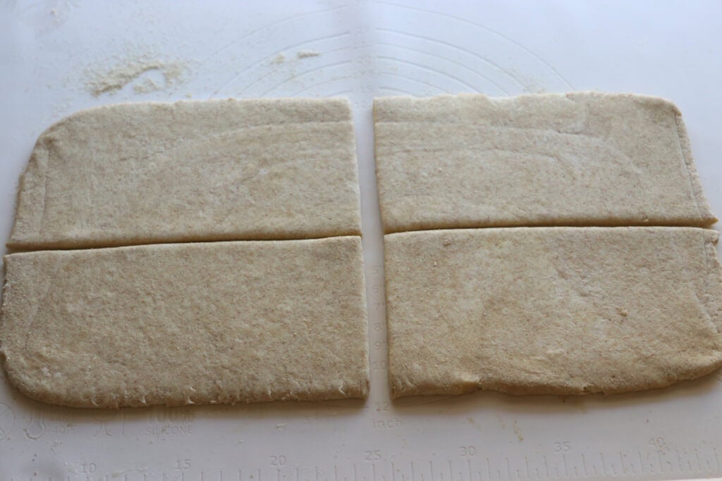 fresh milled flaky buttery croissant dough cut into quarters