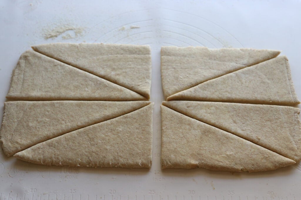 fresh milled flaky buttery croissant dough cut into eight pieces