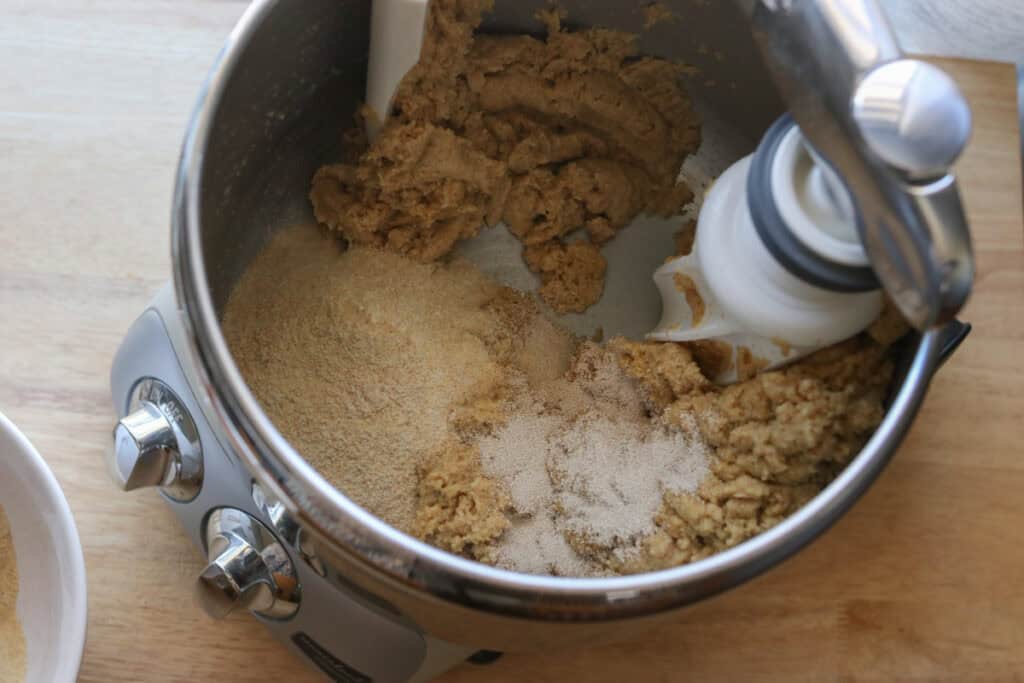 yeast and salt added to the bowl to make Freshly Milled Valentine's Strawberry Cinnamon Rolls