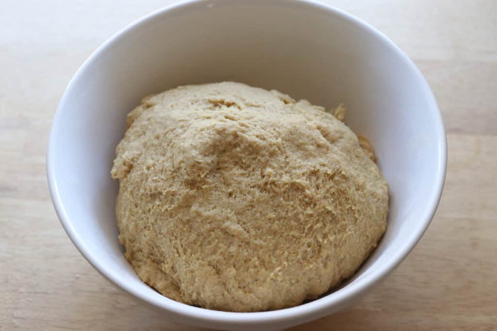 Freshly Milled Valentine's Strawberry Cinnamon Roll dough in a white bowl to rise