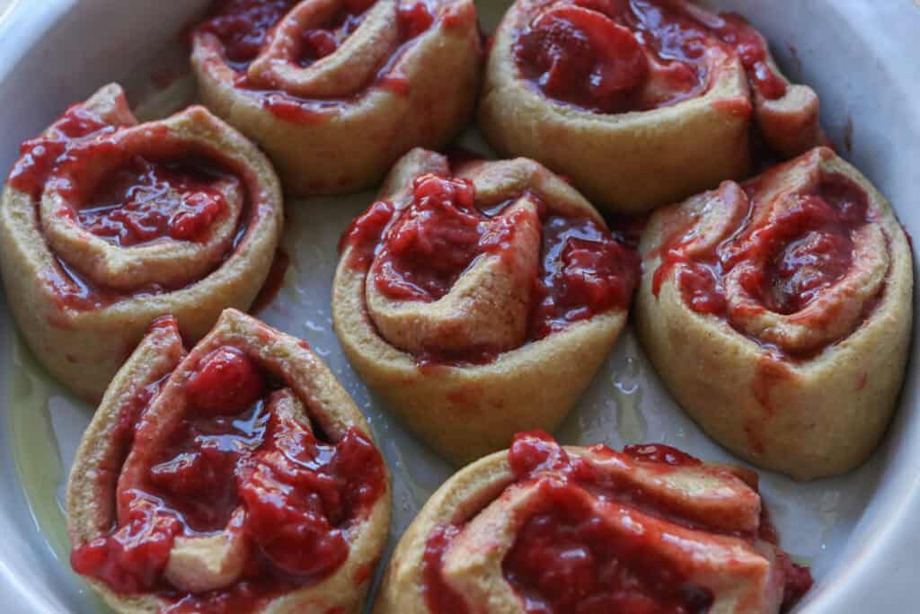 Freshly Milled Valentine's Strawberry Cinnamon Rolls in a round pan to rise
