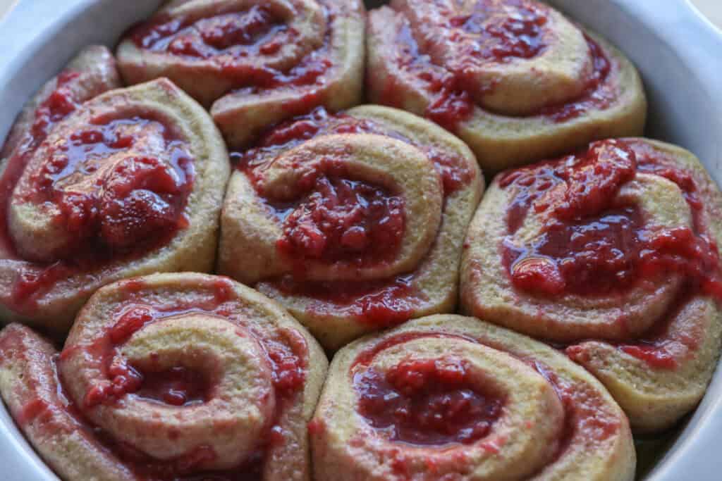 Freshly Milled Valentine's Strawberry Cinnamon Rolls that have doubled in size