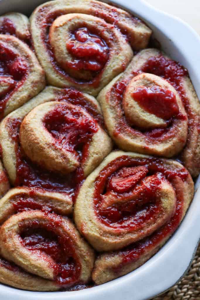 Freshly Milled Valentine's Strawberry Cinnamon Roll with strawberries oozing out in the middle