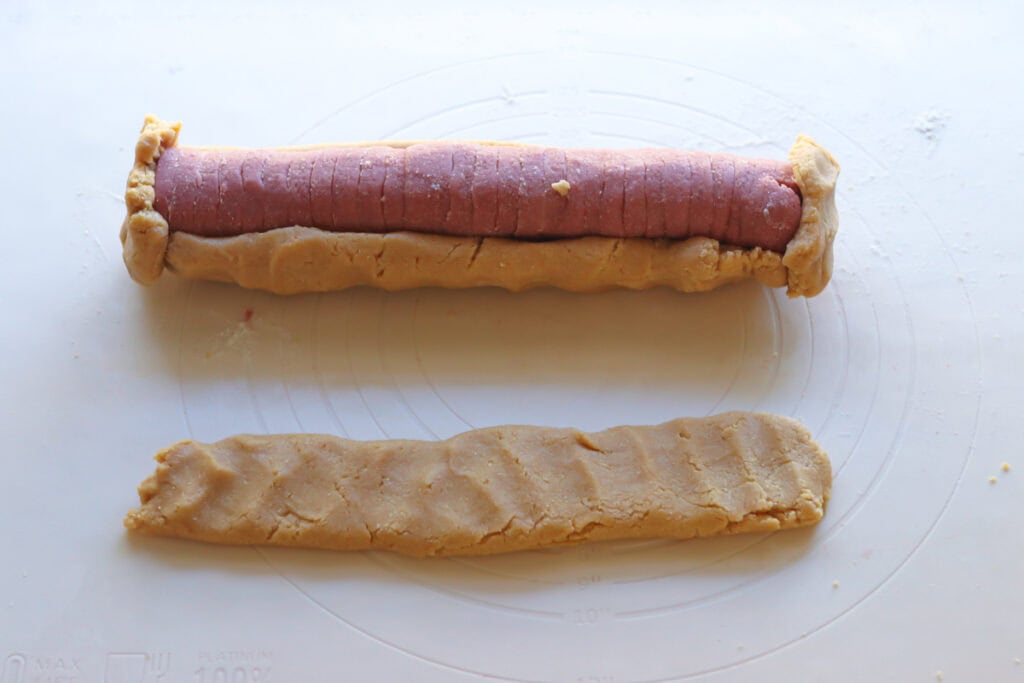 pink hearts with dough wrapped around it to make Freshly Milled Slice and Bake Valentine's Cookies