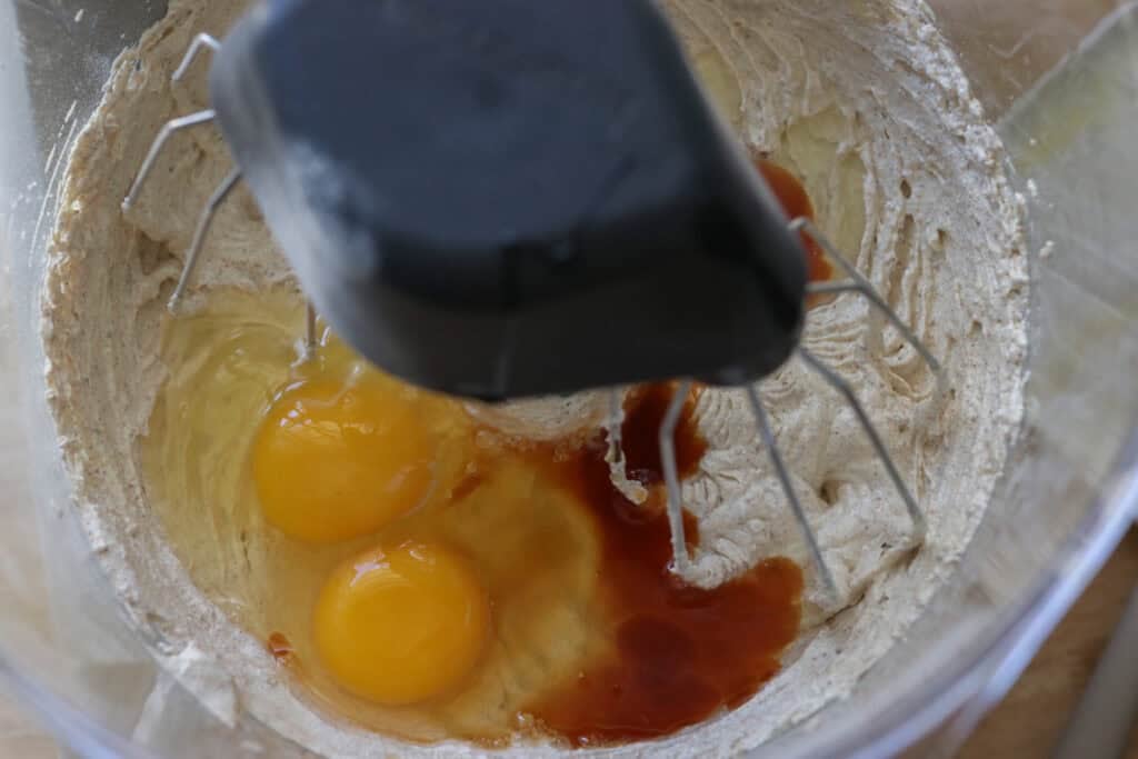 eggs and vanilla in a mixing bowl to make Homemade Ice Cream Sandwiches with Fresh Milled Flour