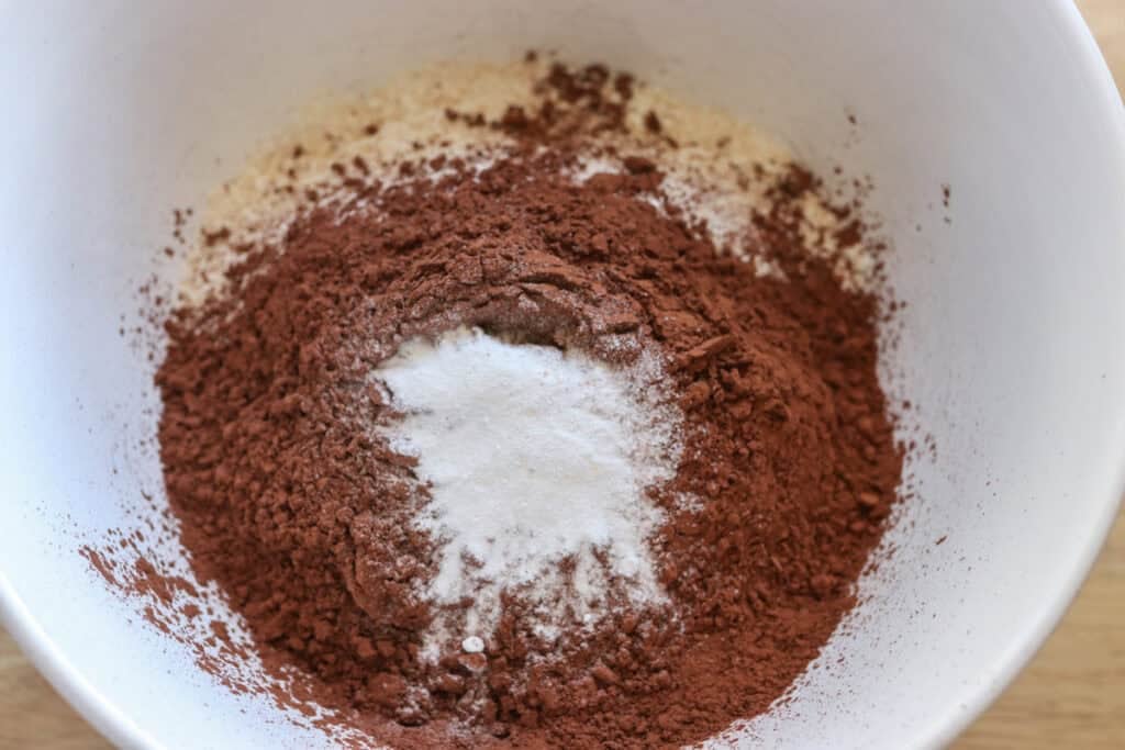 cocoa powder and flour in a white bowl to make Homemade Ice Cream Sandwiches with Fresh Milled Flour