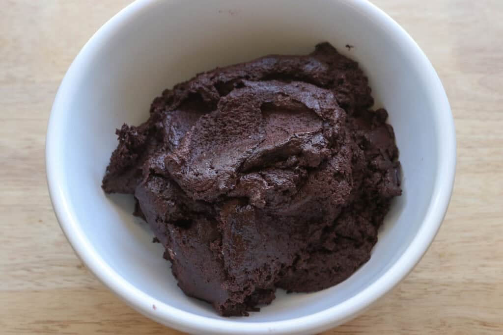 fresh milled sandwich cookie dough in a white bowl