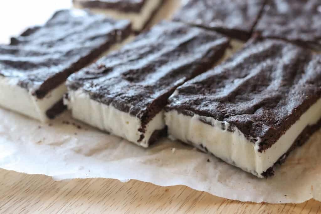 three freshly milled fudgy cookie ice cream sandwiches